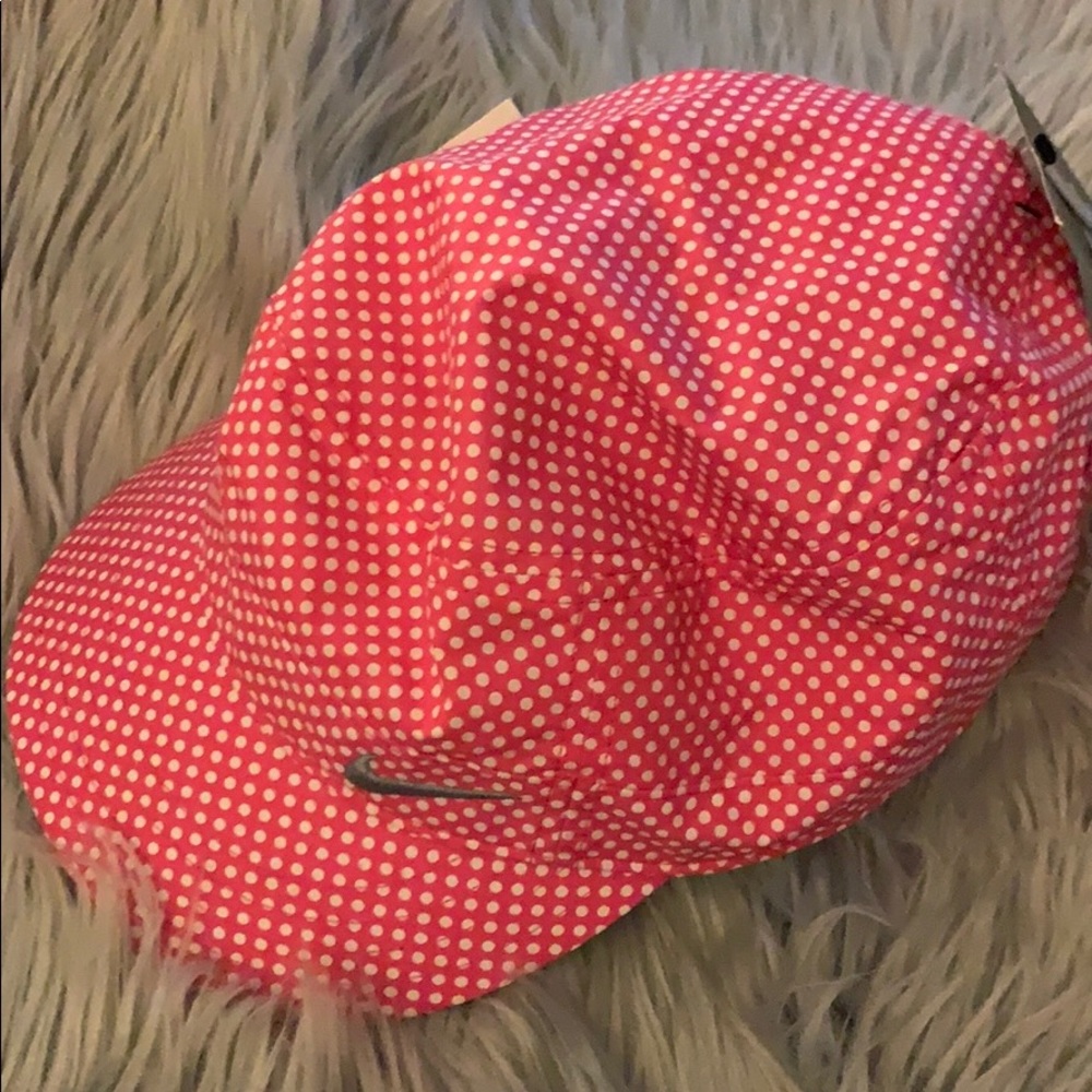 Pink and white Nike cap